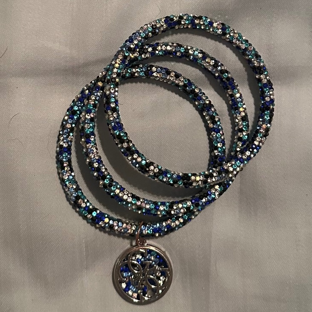 Set of three Guess brand bangles.